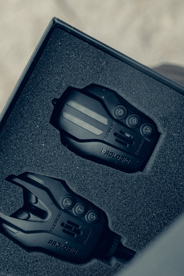 A black Prologic electronic bite alarm and receiver displayed in a foam-lined presentation box.